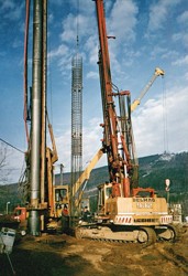 Installing a reinforcement cage into the cased hole