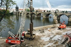 Excavation of diaphragm walls for the garage foundation used for bedding of a sliding closure in the Čertovka, carried out as a part of the anti-flood protection measures in Prague