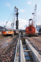 Excavation of a diaphragm wall trench within the pre-prepared guiding walls