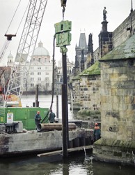 Sheet piles vibrating into a prebored hole carried out using a continuous auger and filled with clay-cement mixture; protection of the pillars no. 8 and 9 of the Charles Bridge in Prague