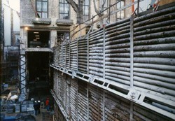 Anchored rider bracing from non-squared wood; reconstruction and final building works at Slovansky House in Prague